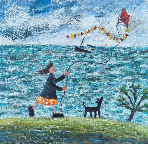 LILY AND NORMA ARE HAPPY TO BE FLYING THIER KITE NEXT TO THE SEA